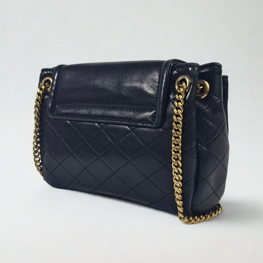 Saint Laurent Mini Nolita in pelle nera trapuntata con finiture oro