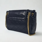 Saint Laurent Mini Nolita in pelle nera trapuntata con finiture oro