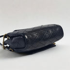 Saint Laurent Mini Nolita in pelle nera trapuntata con finiture oro